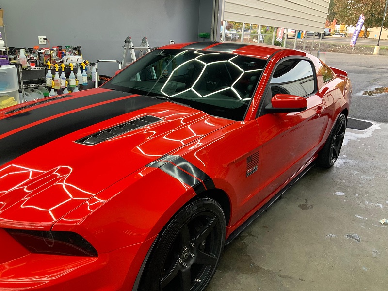 Glossy red Mustang after a professional detail