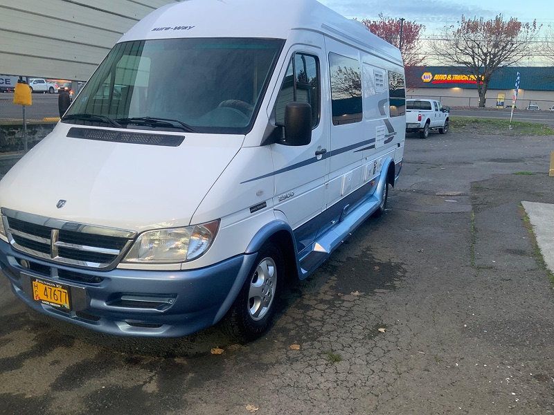 Clean white camper van after service